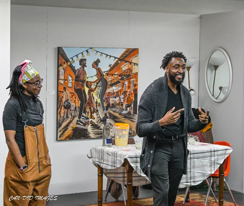A conversation in front of the artwork.