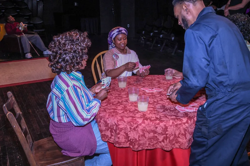 A conversation around the stage table.