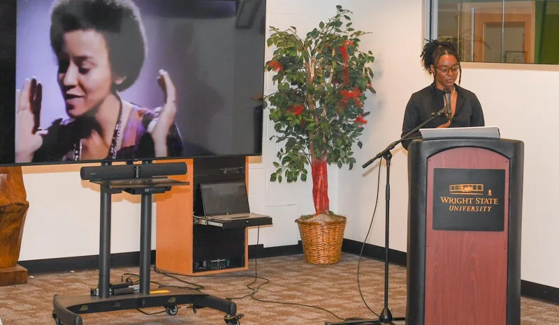 A speaker addressing the room.