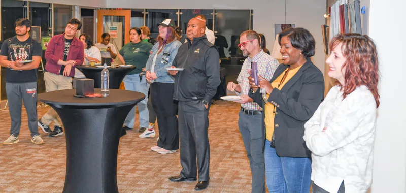 Guests listening during the gathering.