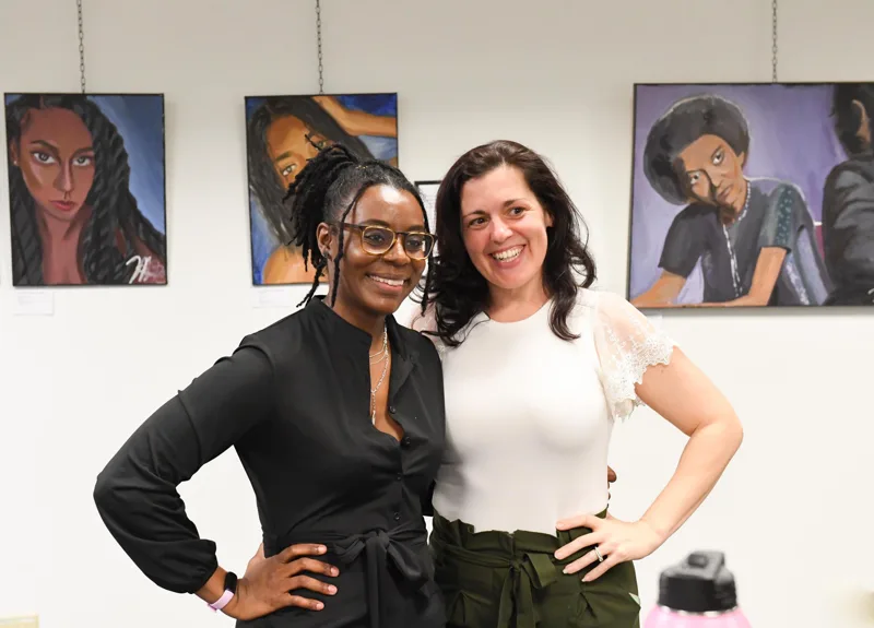 Smiles among the artwork.